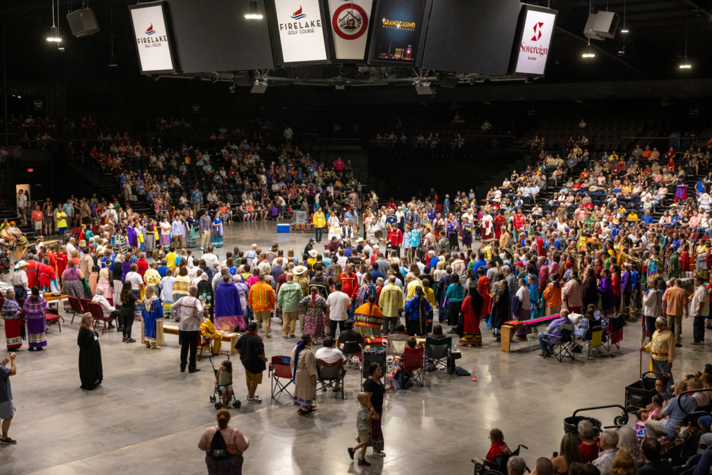 Wide angle photo of Grand Entry inside FireLake Arena at the 2024 CPN Family Reunion Festival.