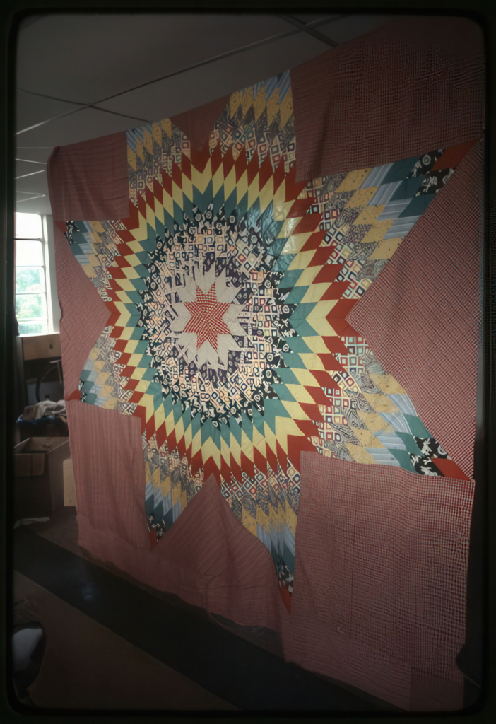 Multicolored star blanket on display.